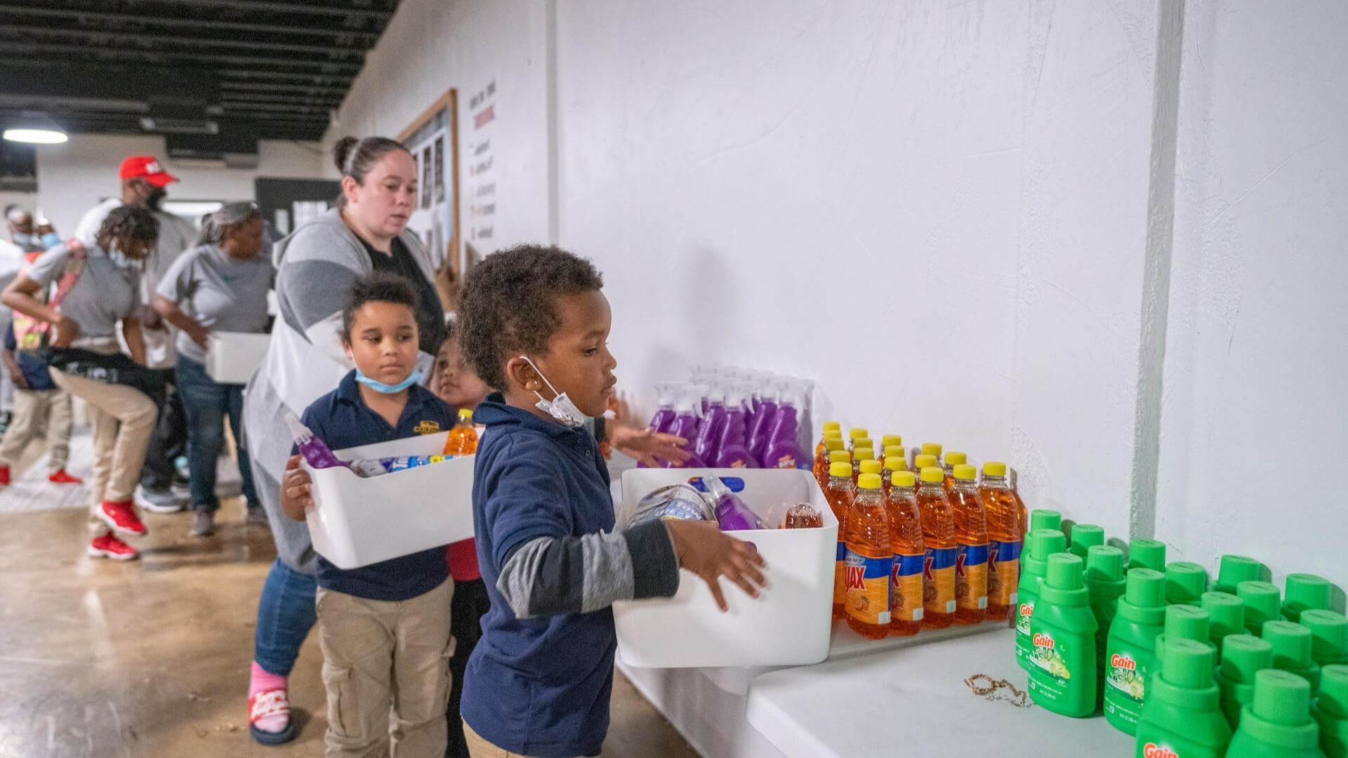 kids in line filling baskets of food